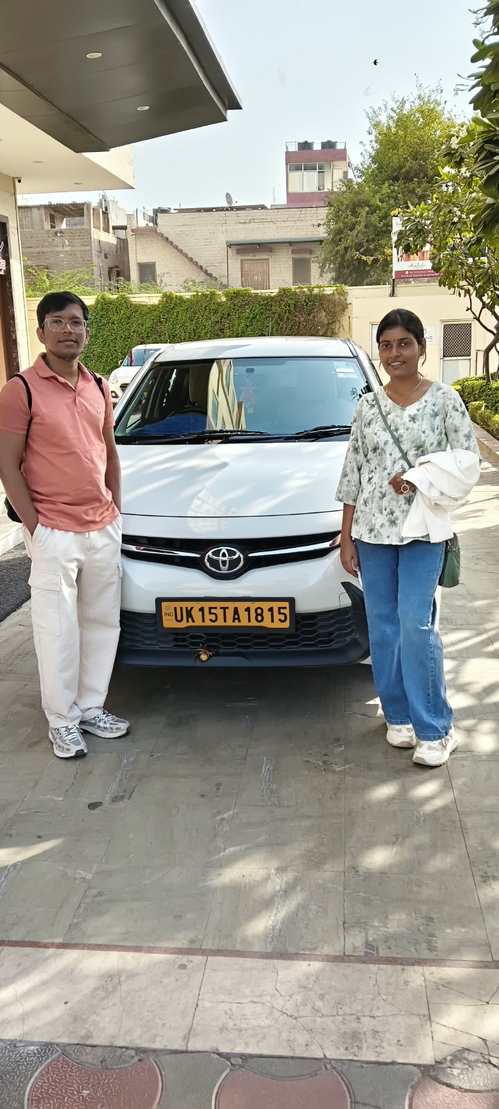 Guests beside their taxi