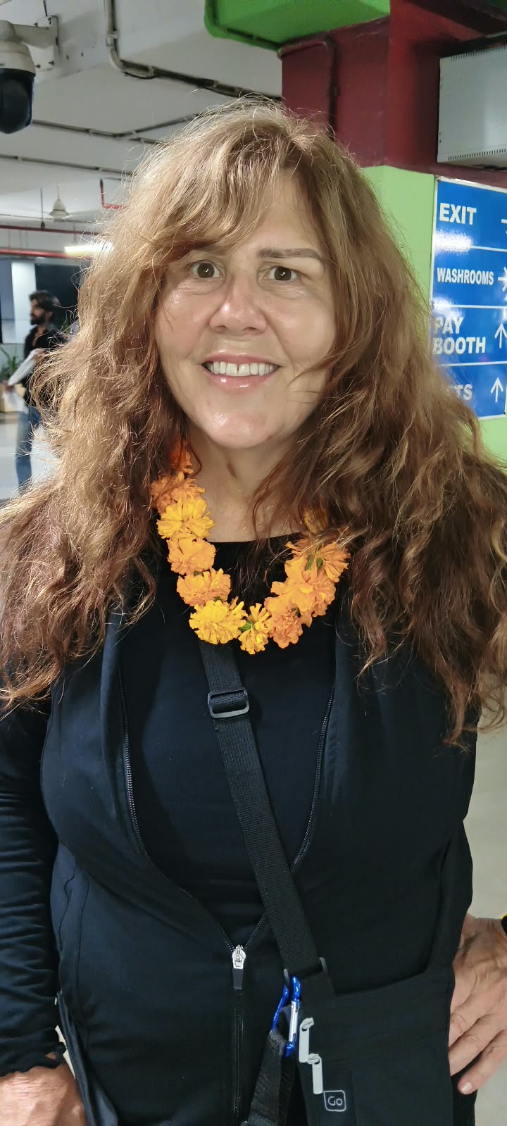 A guest welcomed with a flower garland