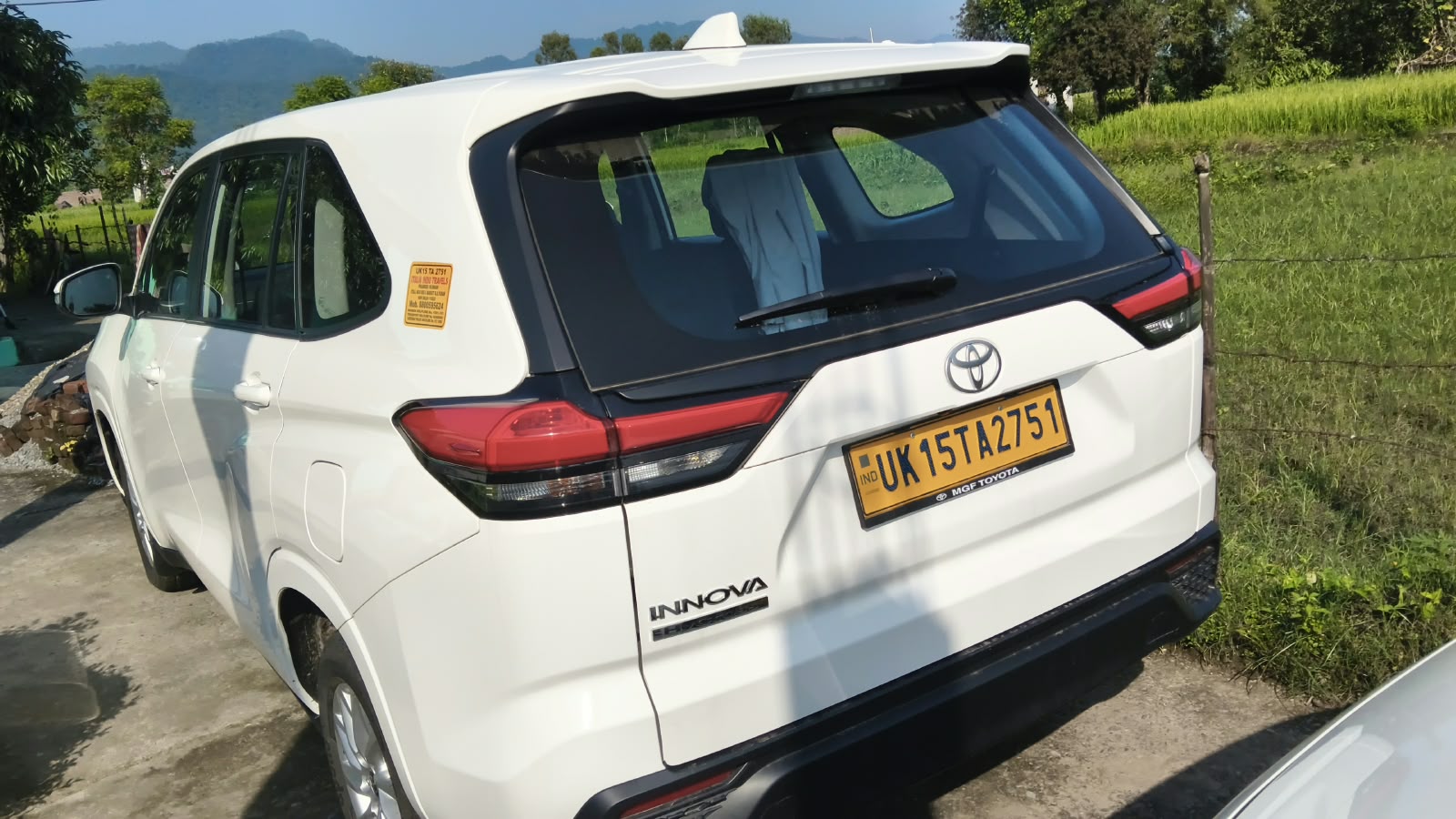 Our vehicle photographed from the rear and side